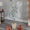 5ft. Pre-Lit Winter Flocked Leaning Artificial Christmas Tree in Decorative Planter, White LED Lights
